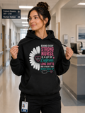 Behind Every Strong Nurse Hoodie in Black