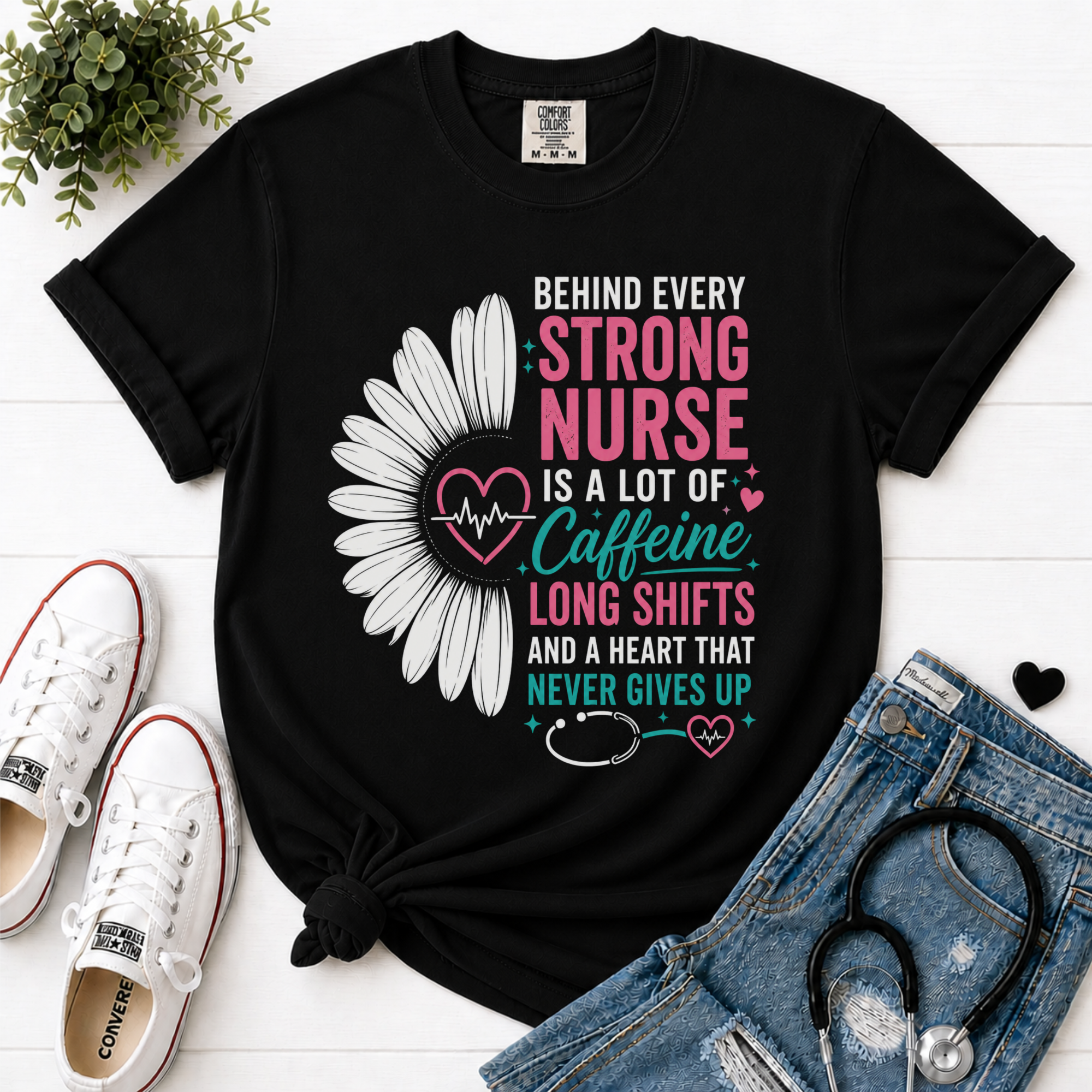 Behind Every Strong Nurse Comfort Colors T-Shirt Black flatlay with stethoscope and sneakers