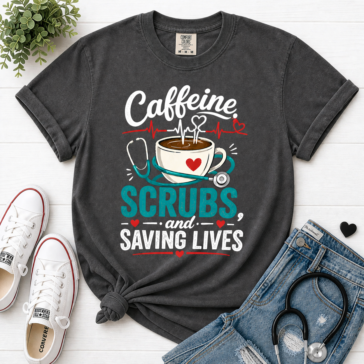 Caffeine Scrubs and Saving Lives nurse t-shirt in Pepper - Comfort Colors flatlay