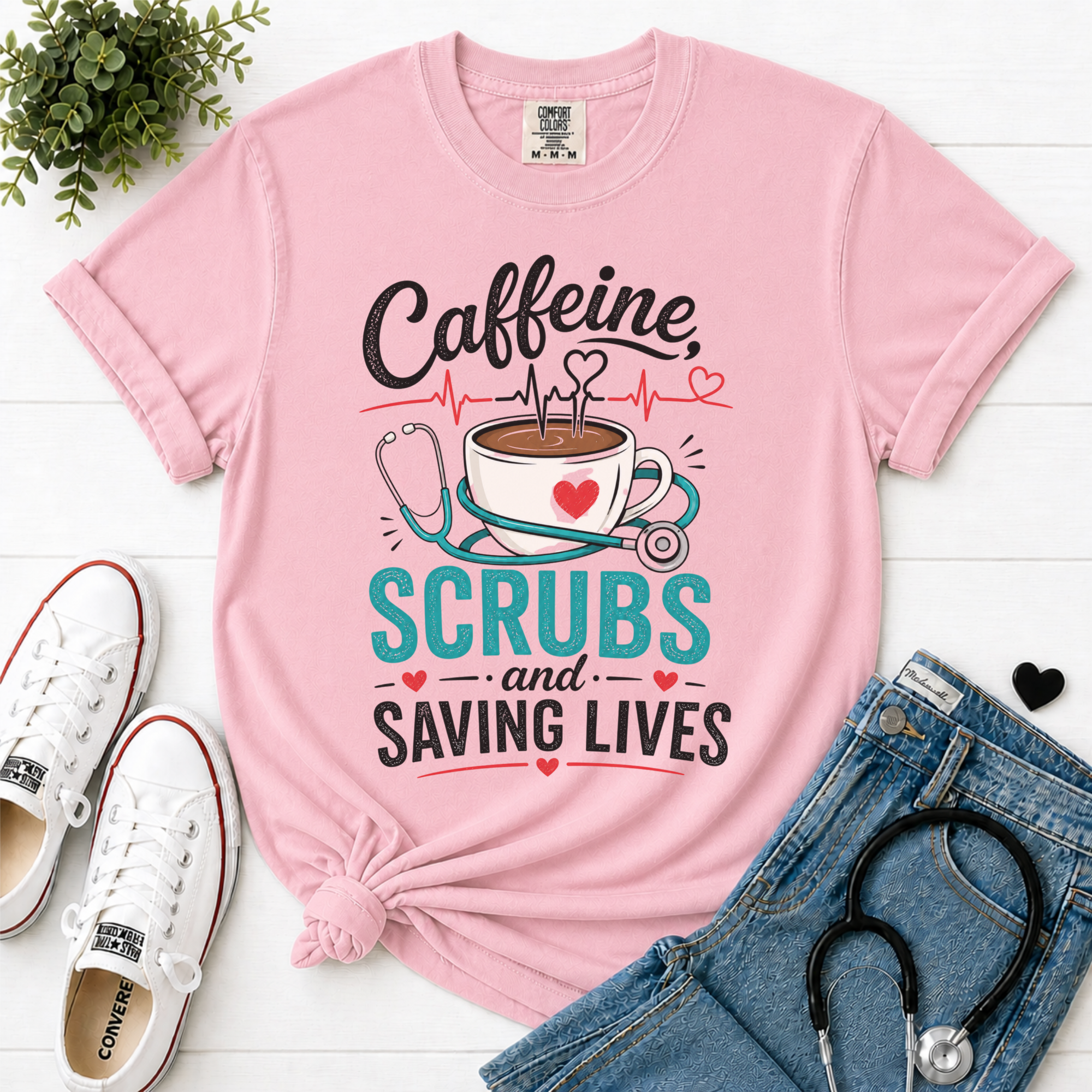 Caffeine Scrubs and Saving Lives nurse t-shirt in Blossom - Comfort Colors flatlay